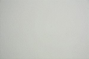 Close-up of a textured white wall, ideal for backgrounds in design projects.